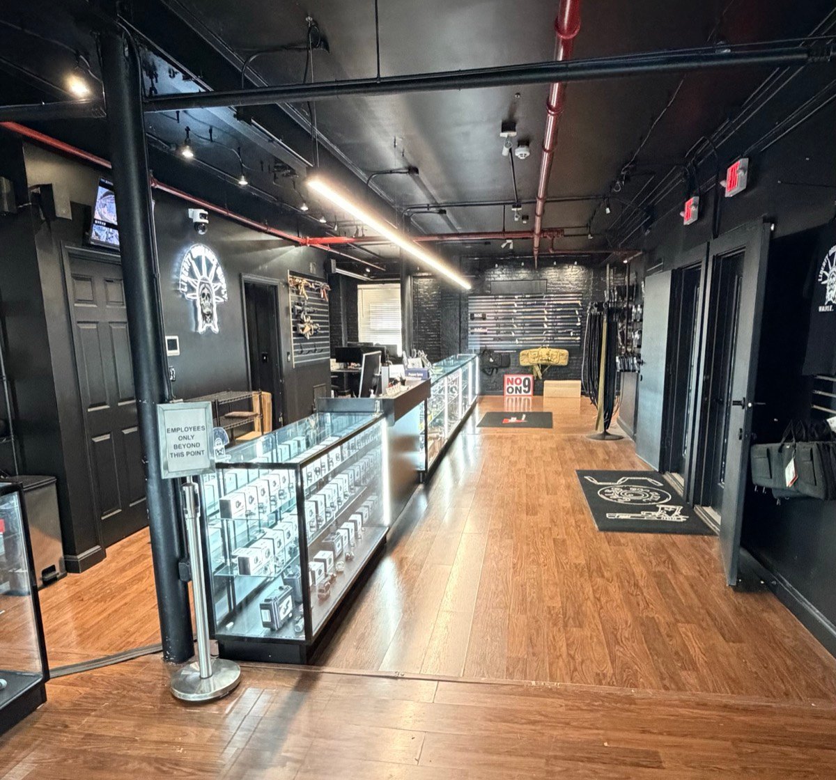 Looking down the main aisle of the store past the glass cases
